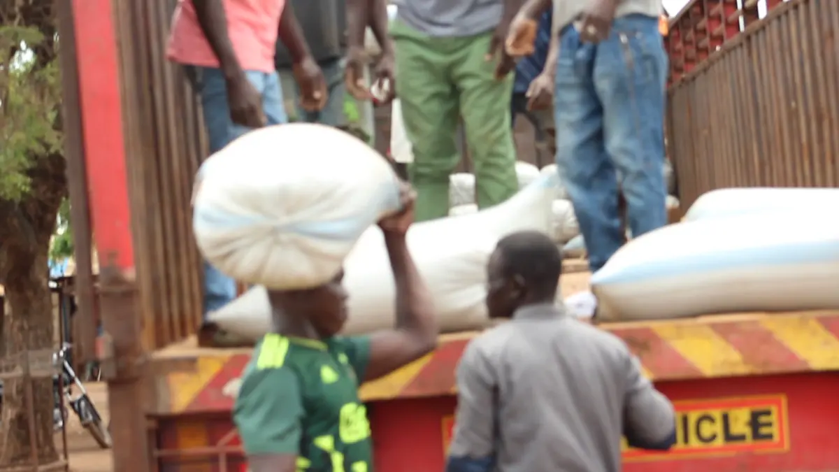 Bags being loaded onto a truck at a warehouse