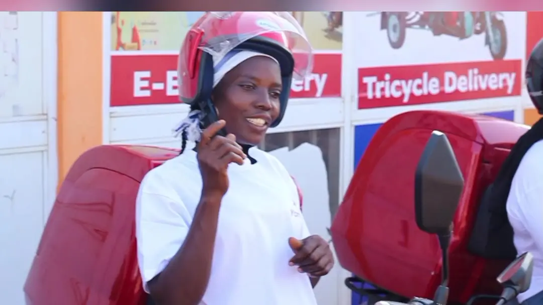 YomYom rider smiling outside the office